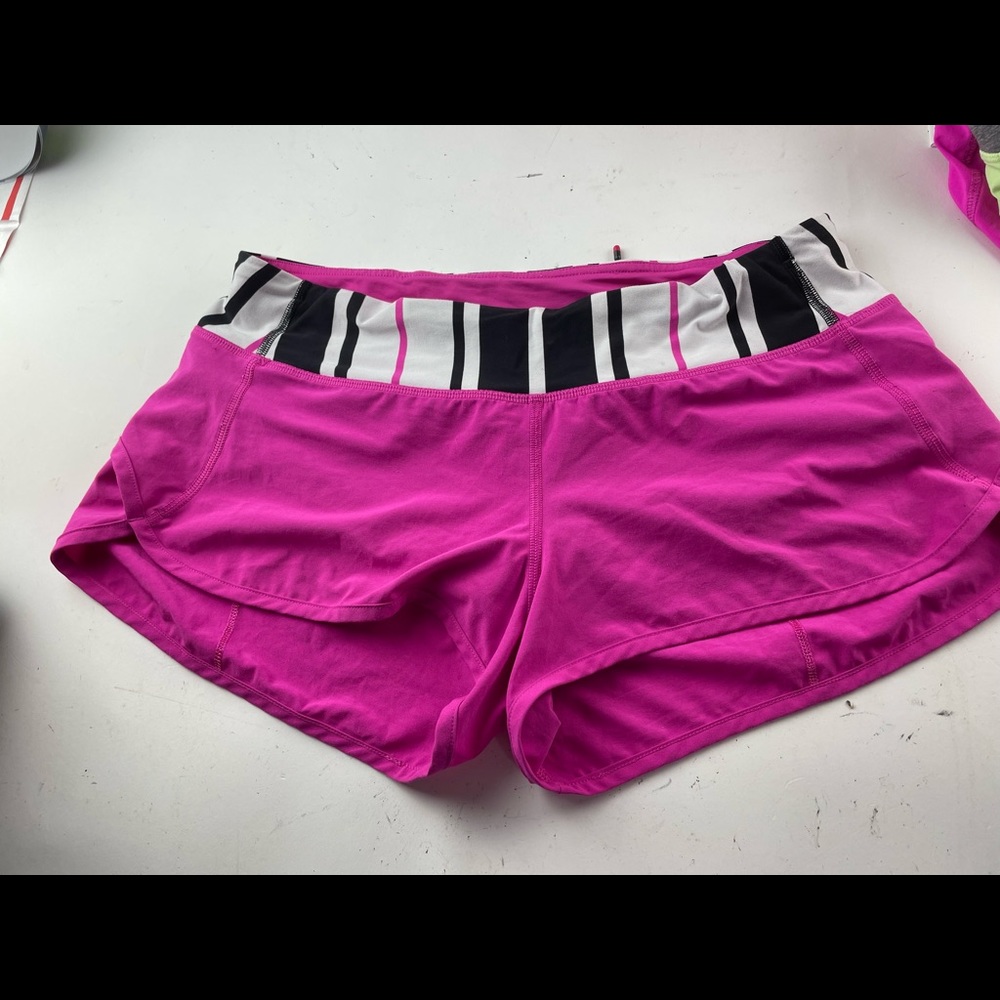 Bright pink Lululemon 8 speed shorts